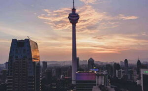 Kuala Lumpur City Tour with KL Tower Ticket - Getting picked up in the city and rolling with an English guide